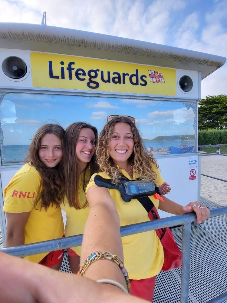 Sky, Ava and Ella. Lifeguards from Gyllyngvase, Cornwall, South West. 